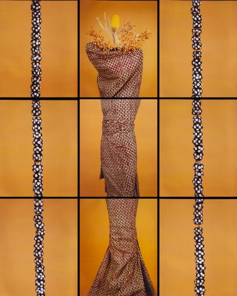 Together, nine photograph tiles show the silhouette of a body, wrapped in fabric and wearing a straw headdress.