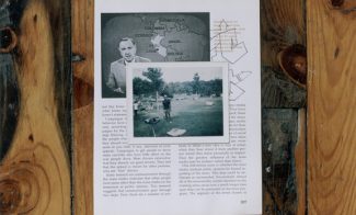 A color photograph depicts a snapshot of a Black man standing in a yard lying, on top of a page from a textbook showing a photo of Walter Cronkite next to a map of South America, displayed flat on a wooden floor.