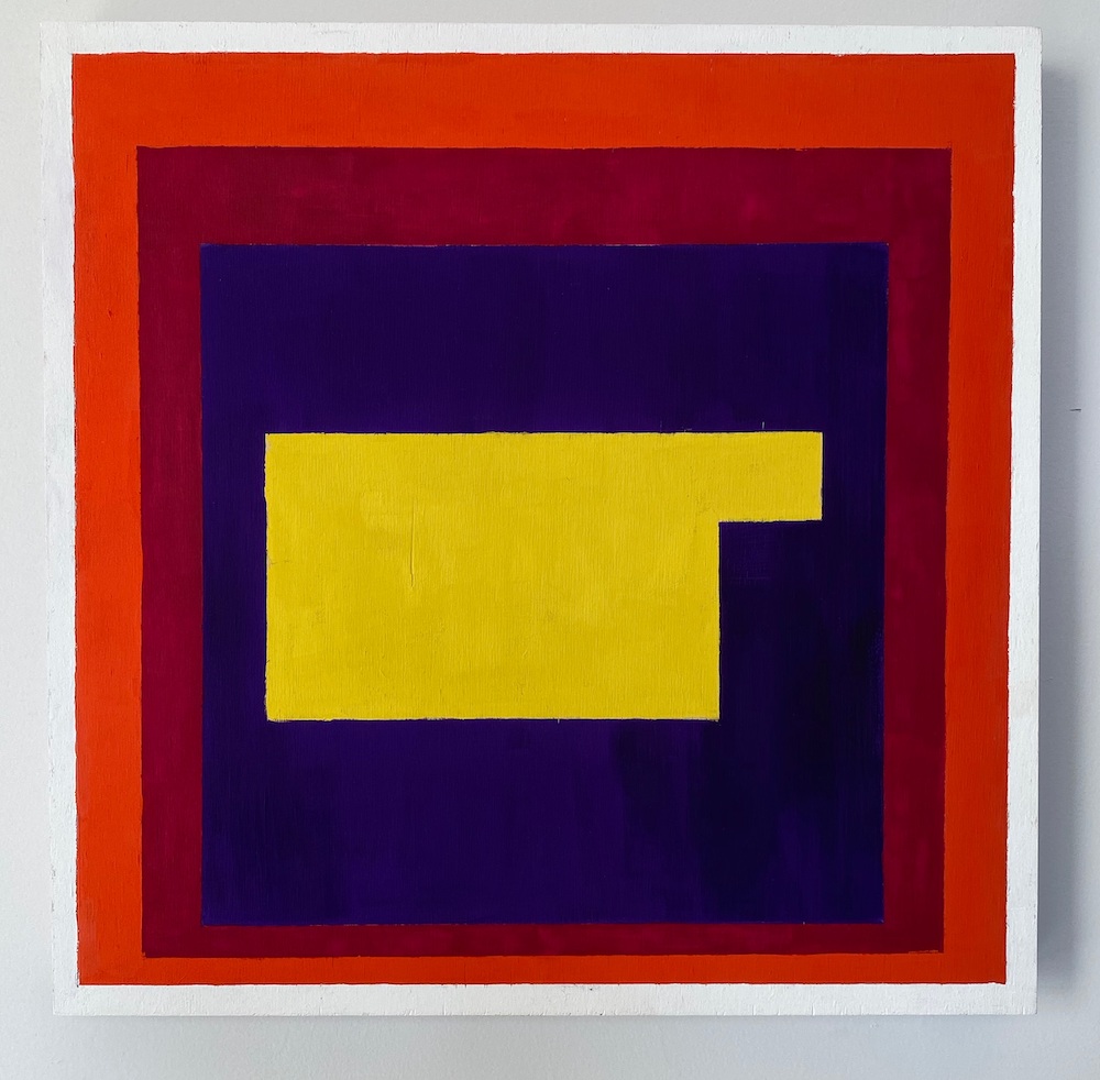 A yellow, rectangle-like shape is centered within a purple square, which is bordered by a burgundy square, within a red square.