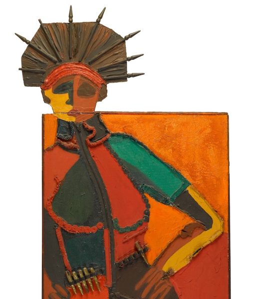 A colorful abstract sculpture depicting a human figure with a vibrant orange background. The figure has a textured surface, vivid clothing in red, green, and yellow, and a spiky headdress, suggesting a mix of cultural and artistic elements.