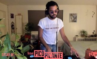 A DJ stands in a room mixing music with headphones on. He wears a t-shirt with text on it. The room is decorated with plants and art. A banner at the bottom says Virtual Pico Picante.
