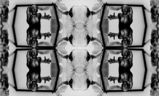 A symmetrical, mirrored black and white image featuring abstract, muscular human figures positioned expressively. The figures are arranged in a pattern resembling a kaleidoscope effect, creating a sense of movement and depth.