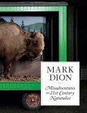 A buffalo stands inside a mobile green display case with a forest background. The text reads, Mark Dion: Misadventures of a 21st-Century Naturalist.